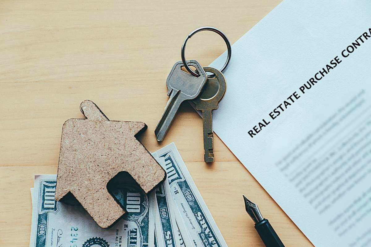 Repossessed home with a sold sign in front.