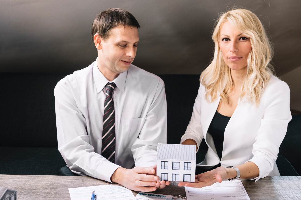 Handshake over property documents.