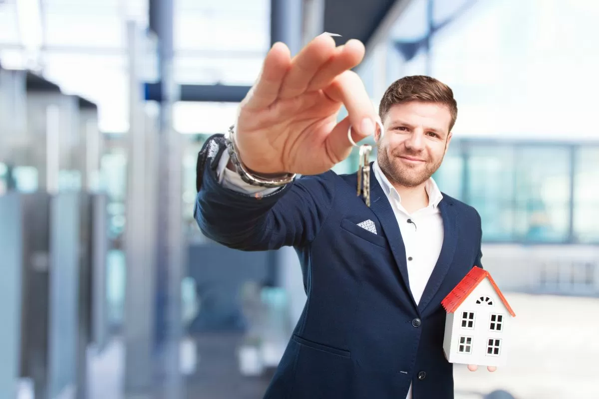 Person reviewing multiple property listings.