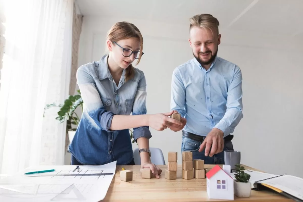 Investor signing documents to sell a property portfolio.