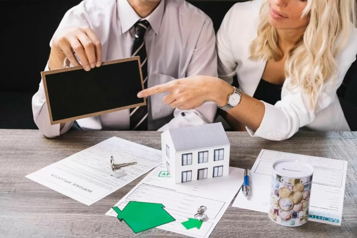 Investor reviewing contract for selling property portfolio.